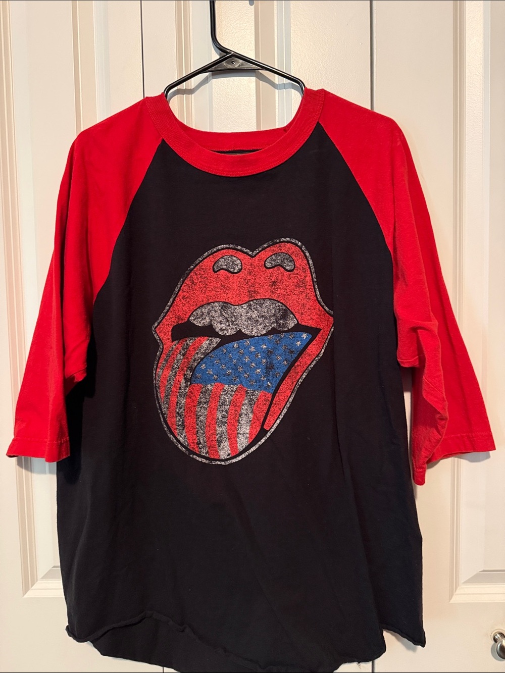 the Rolling Stones Black Tee with Red Raglan Sleeves and Patriotic Tongue Logo